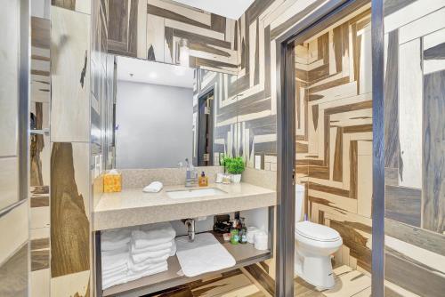 a bathroom with a sink and a toilet at Good Hotels Downtown Denver in Denver