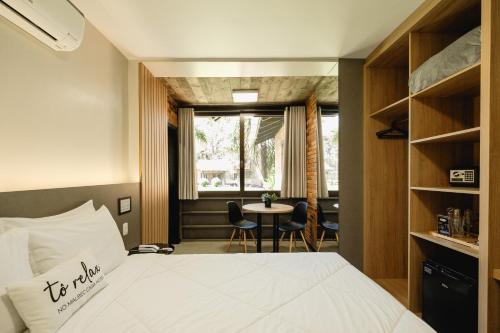 Postel nebo postele na pokoji v ubytování Malbec Casa Hotel