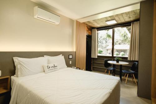 Postel nebo postele na pokoji v ubytování Malbec Casa Hotel