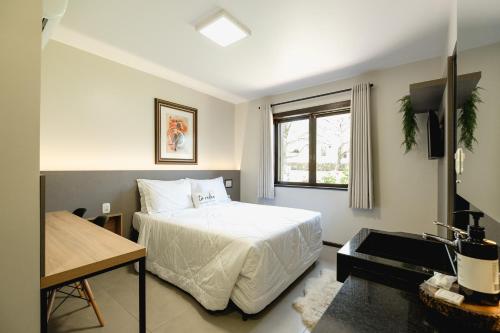 Postel nebo postele na pokoji v ubytování Malbec Casa Hotel