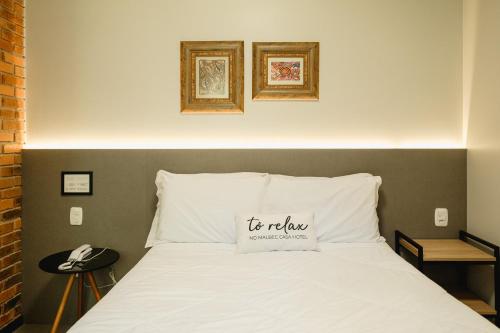 Postel nebo postele na pokoji v ubytování Malbec Casa Hotel