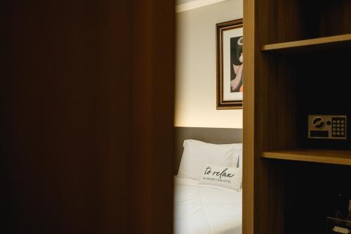 Postel nebo postele na pokoji v ubytování Malbec Casa Hotel