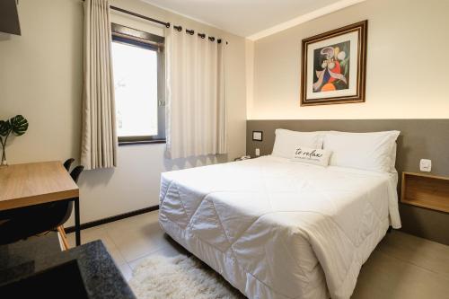 Postel nebo postele na pokoji v ubytování Malbec Casa Hotel