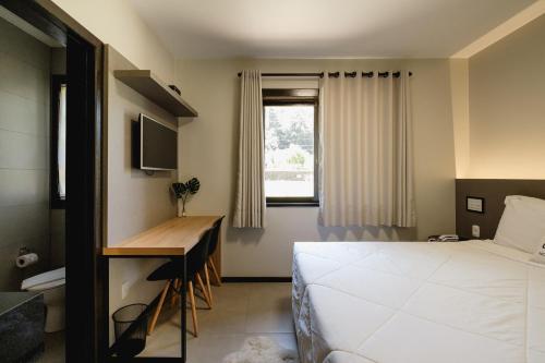 Postel nebo postele na pokoji v ubytování Malbec Casa Hotel
