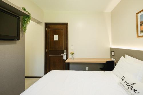 Postel nebo postele na pokoji v ubytování Malbec Casa Hotel
