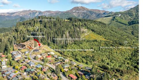 an aerial view of a village in the mountains at The Shepherds Hut - boutique retreat. in Hanmer Springs