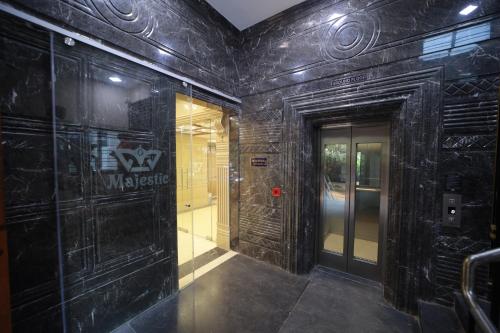 a hallway of a building with a subway train at Majestic Hotel in Madurai