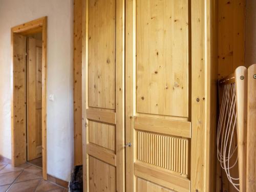 a room with wooden paneled walls and a door at Apartment in Bad Kleinkirchheim Ski Area in Bad Kleinkirchheim