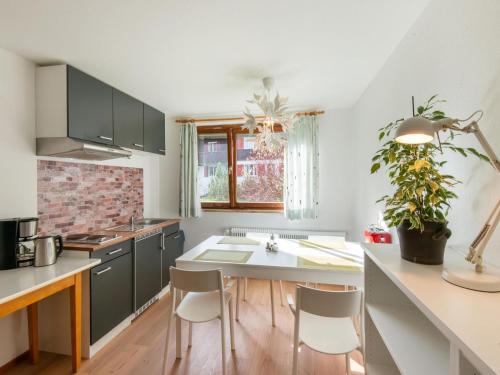 a kitchen with a table and chairs in a room at Chalet in Sibratsgfäll near Ski Slopes in Sibratsgfäll