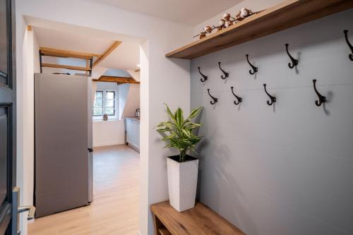 a kitchen with a bunch of hooks on the wall at House Leska in Kranjska Gora