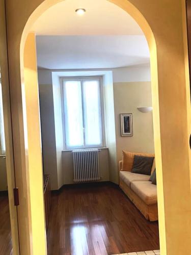 a living room with a couch and a window at Casa De Pellegrin Bellagio Lake Como in Bellagio