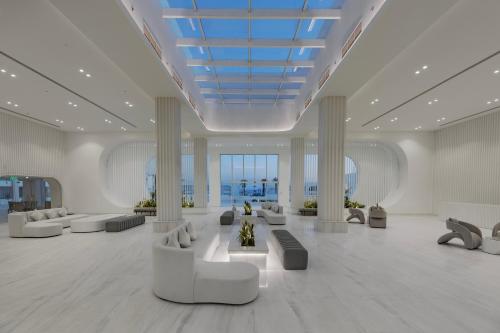 a large lobby with couches and chairs in a building at White Hills Resort in Sharm El Sheikh