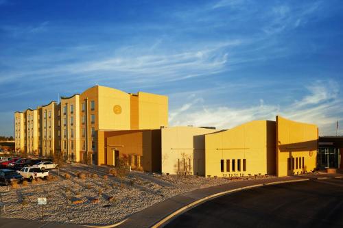 a building in a parking lot next to a building at Zia Park Casino, Hotel, & Racetrack in Hobbs
