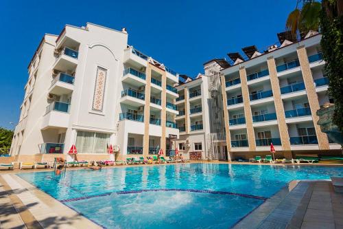 a swimming pool in front of a hotel at Epic Hotel in Marmaris