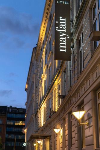 a hotel sign on the side of a building at Hotel Mayfair in Copenhagen