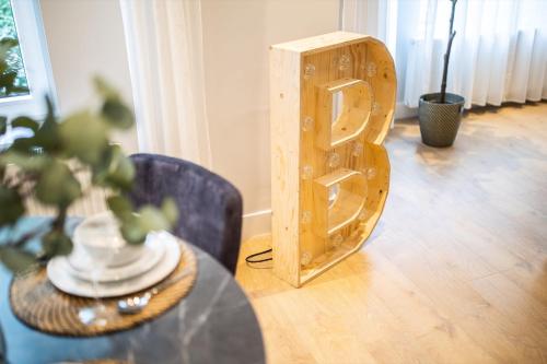 a wooden speaker sitting on a table in a room at Villapark in Rotterdam