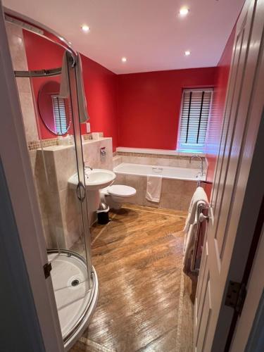 a bathroom with a shower and a sink and a toilet at Haley's Hotel in Leeds