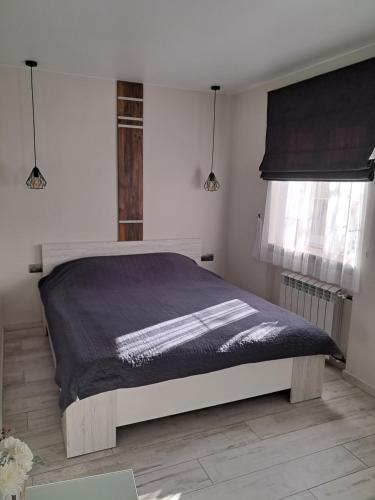 Un pat sau paturi într-o cameră la super apartment пр. Кирова (А.Поля) г.Днепр