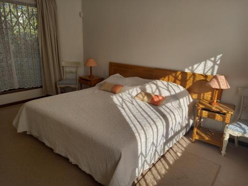Ένα ή περισσότερα κρεβάτια σε δωμάτιο στο Munster Bay Beach House