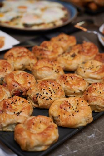a bunch of pastries sitting on a black tray at Faik Pasha Hotels Special Category Beyoglu Istanbul in Istanbul