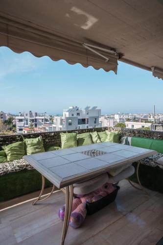 a table sitting on top of a roof at Ioanna's Hellenic Hospitality in Athens
