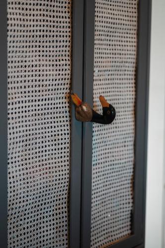 a door with a door knob on a fence at Ioanna's Hellenic Hospitality in Athens