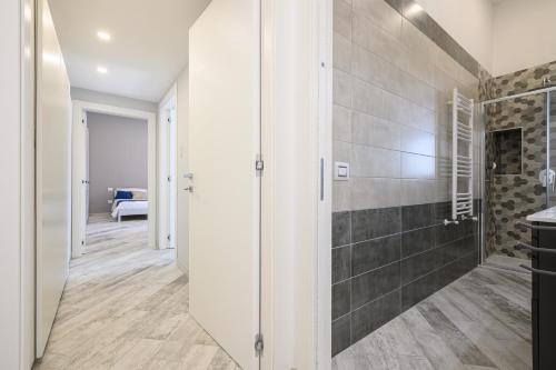 a bathroom with a shower and a walk in shower at [LUNGOMARE 6min] Suite Deluxe Miraglia with Parking in Naples