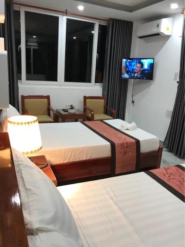 Postel nebo postele na pokoji v ubytování Sunny A Hotel