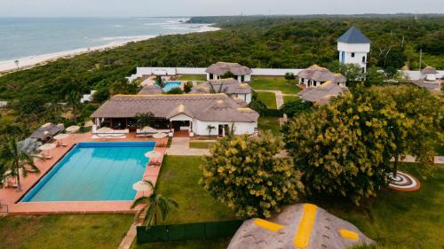 an aerial view of a house with a swimming pool and the beach at Aya Sophia Villa Garden Hotel in Dar es Salaam