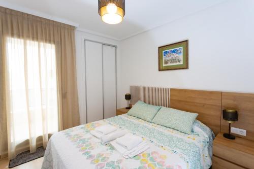 Postel nebo postele na pokoji v ubytování PLAZAMAYOR