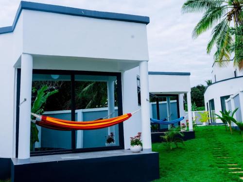 a hammock hanging from the side of a house at homeland bro in Dar es Salaam