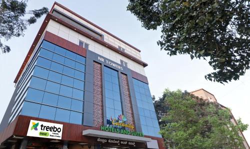 a view of the facade of a hotel at Treebo Celebrity Hotels And Suites in Bengaluru
