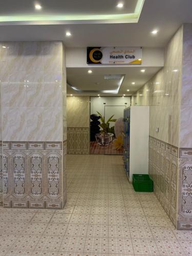a lobby of a hospital with a hallway with a room at Villa Park in Al Khobar