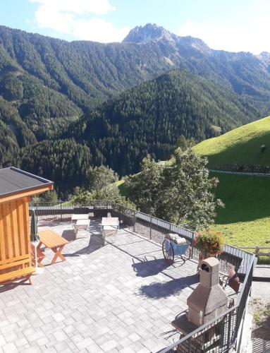 a patio with a view of a mountain at Hofstatthof in Campo di Trens