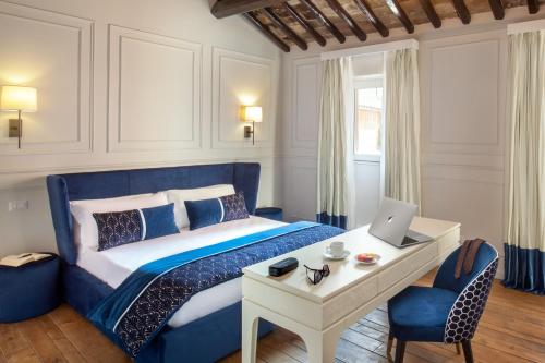 מיטה או מיטות בחדר ב-Campo di Marte