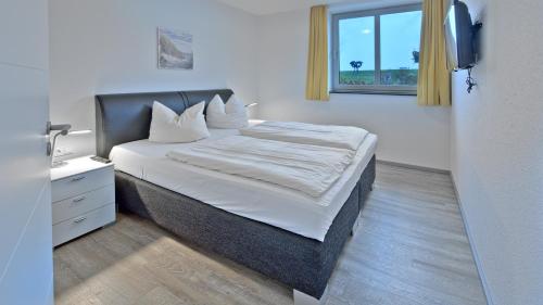 Postel nebo postele na pokoji v ubytování Elbstrand Resort Krautsand