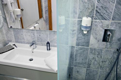 a bathroom with a sink and a mirror at TUI MAGIC LIFE Africana in Hammamet