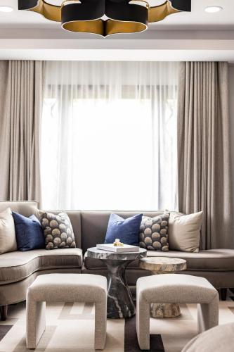 a living room with a couch and a table at Orli La Jolla in San Diego