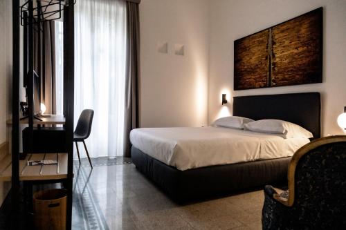 a bedroom with a bed and a television in it at Nostrale bnb in Palermo