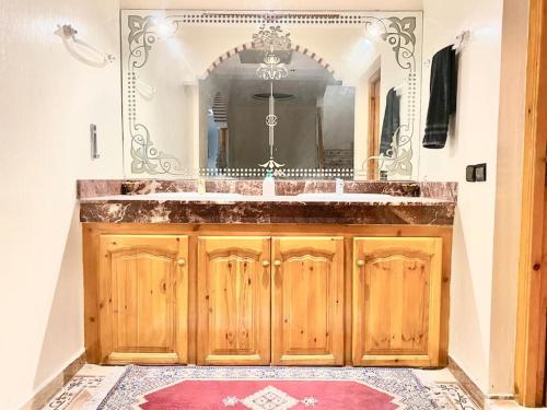 a bathroom with a sink and a mirror at Fully equipped villa Near Agadir in Agadir