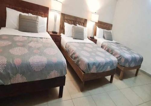 מיטה או מיטות בחדר ב-Hotel Casa Puerta Huasteca
