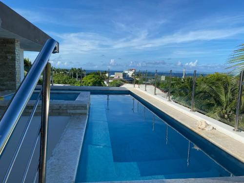 a large swimming pool with a blue water slide at Apartamento Carey in Cabrera
