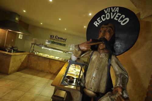 a statue of a man standing in a store at Hotel María Bonita Consulado Americano in Ciudad Juárez