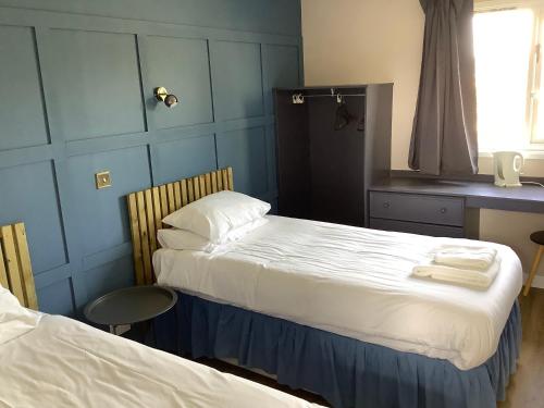 Katil atau katil-katil dalam bilik di The Weigh Inn Hotel & Lodges