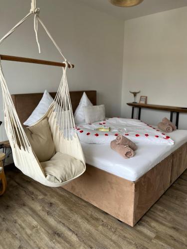 a bedroom with a bed with a swing at Palavahof in Perná