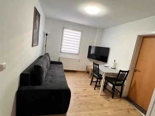 a living room with a couch and a table at Zentrale beautiful Apartment in Koblenz in Koblenz