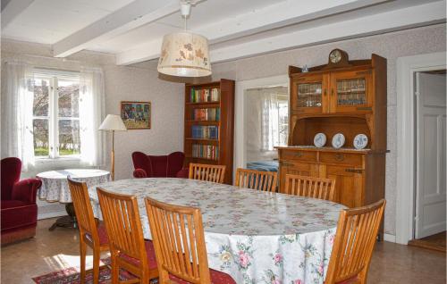 a dining room with a table and chairs at 3 Bedroom Beautiful Home In Ronneby in Ronneby