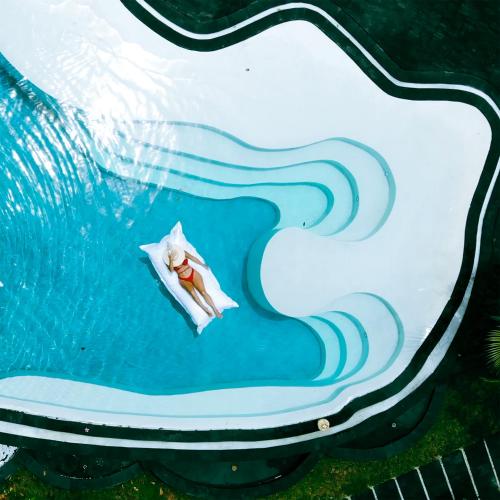 a cake with a boat in the water at ONAYA Bali Resort - Adults Only in Uluwatu