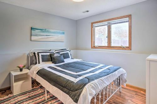 a bedroom with a bed and a window at Lovely Minneapolis Home Near Target Field! in Minneapolis