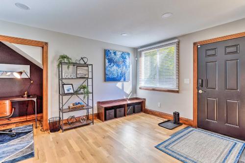 an empty living room with a door and a window at Updated Denver Townhome Less Than 1 Mi to St Josephs in Denver